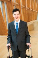 Alex Krneta poses ina suit and tie