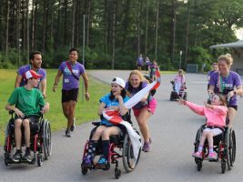 Councilors and campers race across the pavement.