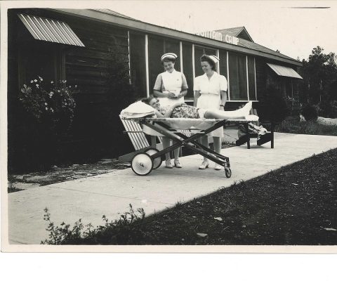 Nurses around a child on a stretcher at Blue Mountain Camp