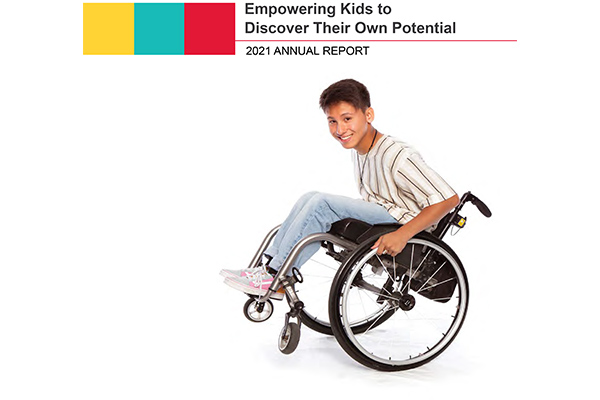 2021 Annual report - Tai pops a wheelie in his wheelchair
