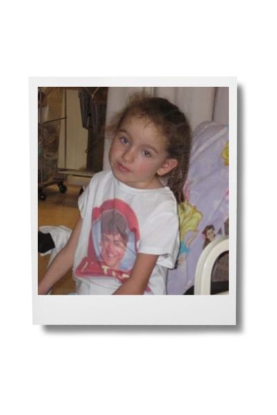 Image of Morgan sitting on bed side