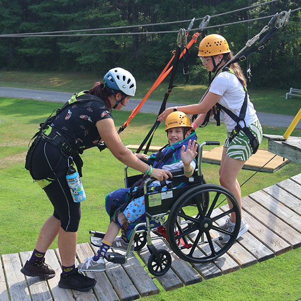 A boy on the high ropes course.