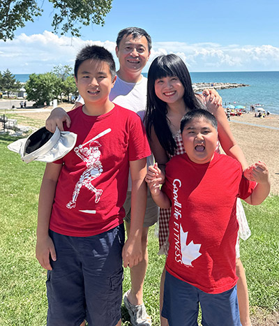 Yixiao and his family at the beach.
