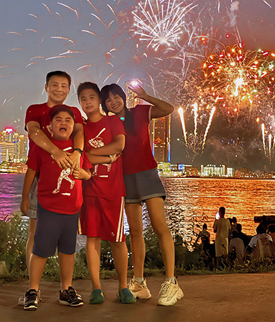 Yixiao and his family enjoy fireworks.