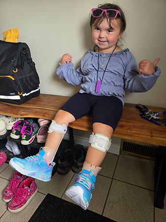 Emberly giving a thumbs up.