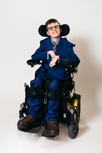 Miles smiling in his chair.