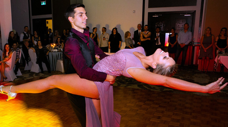 Adam dips Ashley on the dance floor