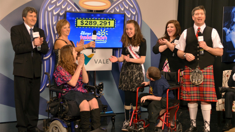 Easter Seals Kids and hosts on stage at the telethon